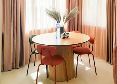 a table with chairs and a bottle of water on top at Marina's Flat in Varna City