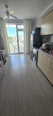 a living room with a kitchen and a microwave at New 3Room Maisonette Apartment in Sunny Day 3 Sunny Beach in Sunny Beach