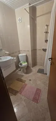 a bathroom with a toilet and a sink and a shower at New 3Room Maisonette Apartment in Sunny Day 3 Sunny Beach in Sunny Beach