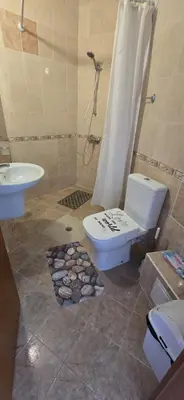 a bathroom with a toilet and a sink and a shower at New 3Room Maisonette Apartment in Sunny Day 3 Sunny Beach in Sunny Beach