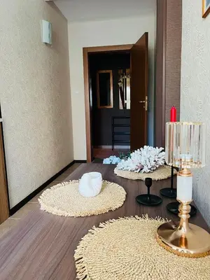 a living room with two circular rugs on the floor at GREEN PARADISE apartments in Sveti Vlas