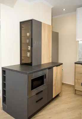 a kitchen with a counter with a microwave on it at Stylish Apartment - the Heart of Central Varna by Flat Manаger in Varna City