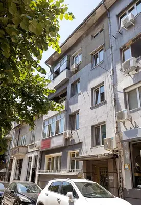 a white car parked in front of a building at Stylish Apartment - the Heart of Central Varna by Flat Manаger in Varna City