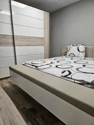 a bedroom with a large bed in a room at Central Flat, Close to the beach in Burgas City