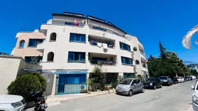 a large white building with cars parked in front of it at ATOS 507 Studio Sunny Beach in Sunny Beach