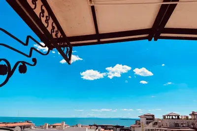 a view of the ocean from a patio at Raduga SP apartments St Vlas in Sunny Beach