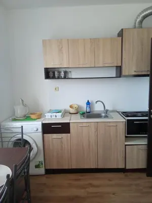 a kitchen with a sink and a stove at Апартаменты за гости Гавань in Byala