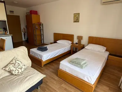 a room with two beds and a couch in it at Vineyards Resort, Aheloy - Studio 32 in Pomorie