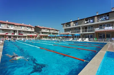 a swimmer in a pool at a resort at ВС Морски дюни in Shkorpilovtsi