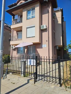 a building with a fence in front of it at Студио Морелия in Tsarevo