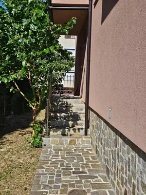 a stone stairway leading up to a building at Студио Морелия in Tsarevo