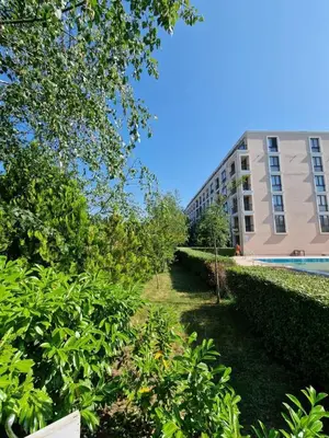 a view of a building and a yard with trees at Villa Astoria 2 - Premium Apartments in Elenite