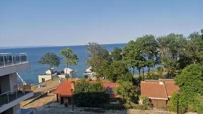 a view of a house with the ocean in the background at One bedroom studio in Chernomorets