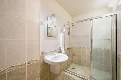 a bathroom with a sink and a shower at Sunny Holiday Apartments in Sunny Beach