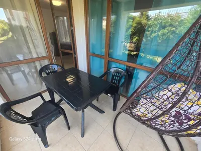 a black table and chairs on a balcony at Elia Relax & Lux in Aheloy