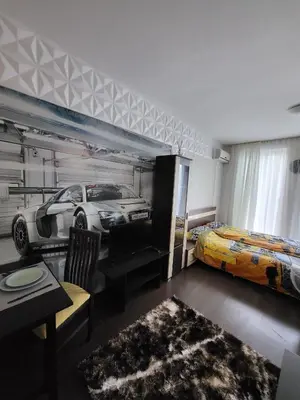 a bedroom with a car mural on the wall at Sunny View SP apartments in Bŭnzareto