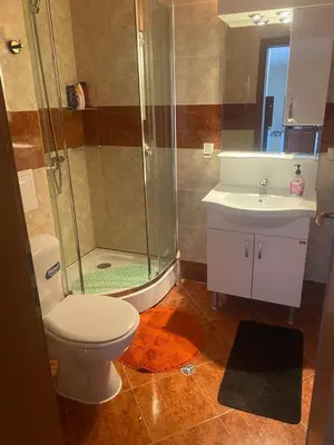 a bathroom with a shower and a toilet and a sink at Pool View, 2 Bedroom Apartment in Sunny Beach