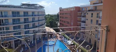a view from the balcony of a building with a swimming pool at Palazzo Sunny beach in Sunny Beach