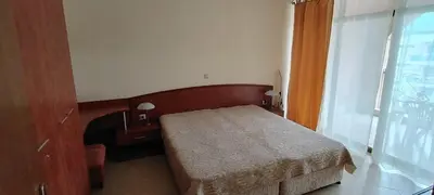a small bedroom with a bed and a window at Palazzo Sunny beach in Sunny Beach