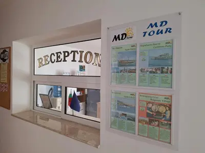 a display wall with posters on a wall at Къща за гости Авеню in Ravda