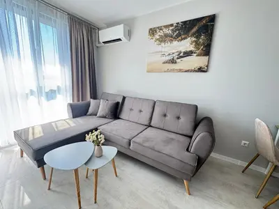 a living room with a couch and a table at Valentina Apartment in Burgas City