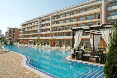 a large swimming pool in front of a building at Grand Кameliq - MORSKI BRIZ apartment in Sunny Beach