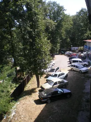 a row of cars parked in a parking lot at Hotel Maria in Kiten