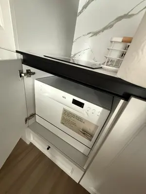 a dishwasher in a kitchen with a glass door at Sea Home 8 in Sunny Beach