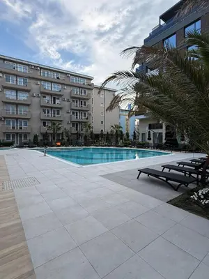 a swimming pool in front of a building at Sea Home 8 in Sunny Beach