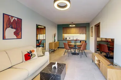 a living room with a couch and a table at BellaViaStay, Flat Thalassa 1BD in Sozopol