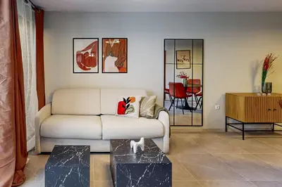a living room with a couch and a table at BellaViaStay, Flat Thalassa 1BD in Sozopol