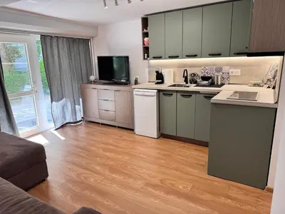 a kitchen with a counter and a sink and a counter top at Studio Briz in Burgas City