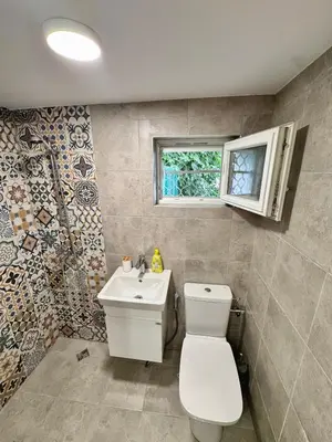 a bathroom with a toilet and a sink at Studio Briz in Burgas City