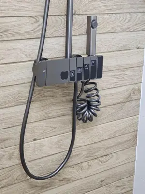 a phone hanging from a wall with a cord at Sunny Bay Sweet Homes Lux Apartment in Sunny Beach