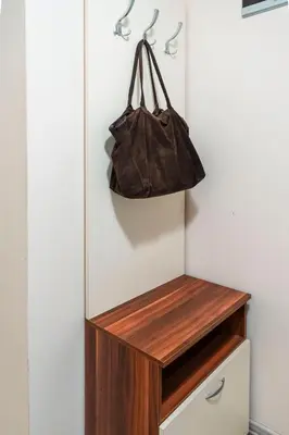 a purse hanging on a wall next to a drawer at Galata Relax in Varna City