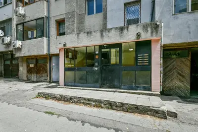an old building with glass doors on a street at Central location 2BR - 6 guests in Varna City