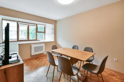 a dining room with a table and chairs at Central location 2BR - 6 guests in Varna City