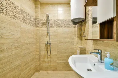 a bathroom with a shower and a sink at Central location 2BR - 6 guests in Varna City