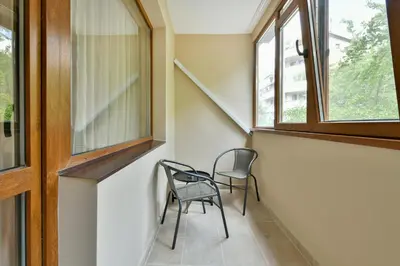 two chairs in a hallway with two windows at Central location 2BR - 6 guests in Varna City
