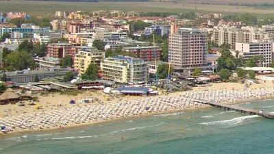 a beach with a bunch of umbrellas and people on it at Prime Location Studio Midia Beach in Sunny Beach