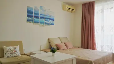 a living room with a couch and a table at Fortuna Cape B46 - Фортуна Кейп В46 in Byala