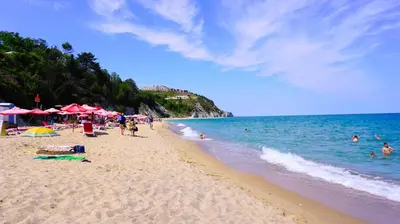 a beach with a bunch of people in the water at Fortuna Cape B46 - Фортуна Кейп В46 in Byala
