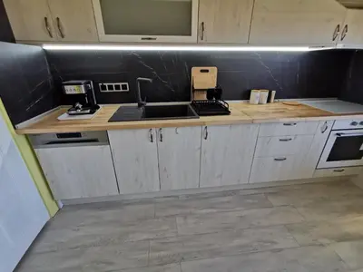 a kitchen with a sink and a counter top at Апартамент Хармония ТОП Център в Стария Град in Pomorie