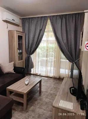 a living room with a couch and a table at Blue Beach Apartments - Melia in Ravda