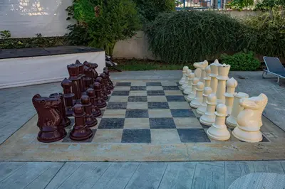 a chess board and chess pieces on a chess board at Rainbow 3 - Menada Apartments in Sunny Beach