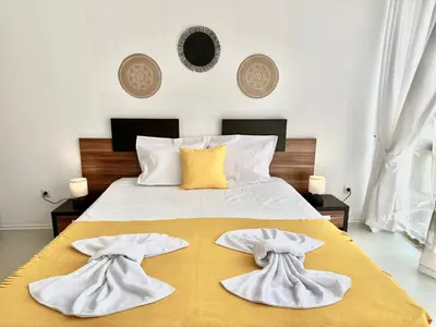 a bedroom with a bed with white towels on it at Rainbow 3 - Menada Apartments in Sunny Beach