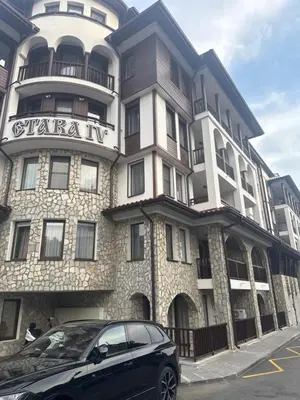 a black car parked in front of a building at Stylish studio near harbor and luxury beach in Sveti Vlas
