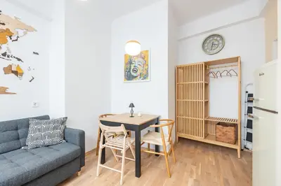 a living room with a table and a couch at California in Varna City