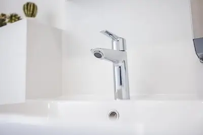a sink with a faucet in a bathroom at California in Varna City