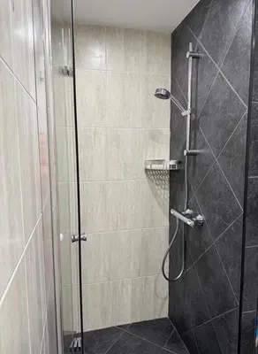 a shower with a glass door in a bathroom at Dream Life Sozopol in Sozopol